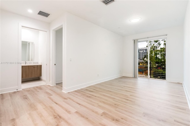 unfurnished room featuring light hardwood / wood-style floors