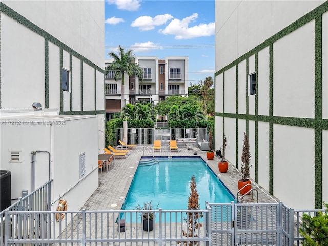 view of swimming pool with a patio