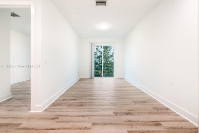 spare room featuring light hardwood / wood-style floors