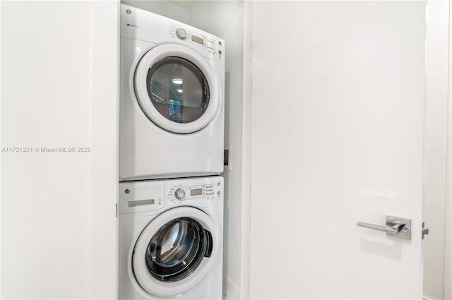 clothes washing area with stacked washer / drying machine