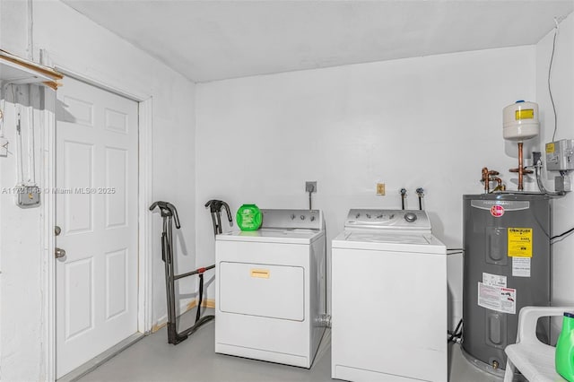 clothes washing area with electric water heater and washing machine and clothes dryer