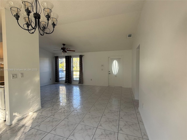 entrance foyer with ceiling fan with notable chandelier and vaulted ceiling