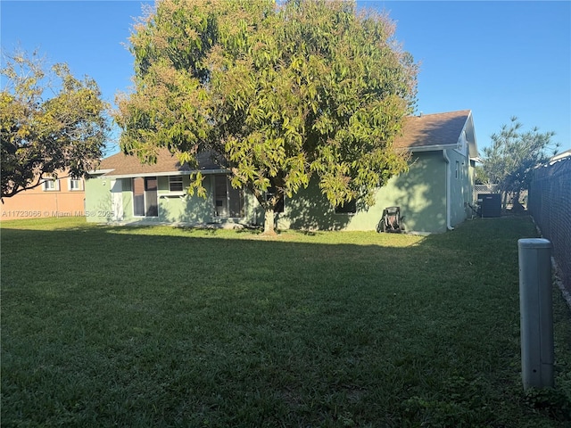 view of yard with central AC unit