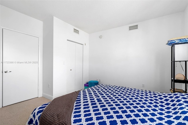 bedroom with carpet flooring and a closet