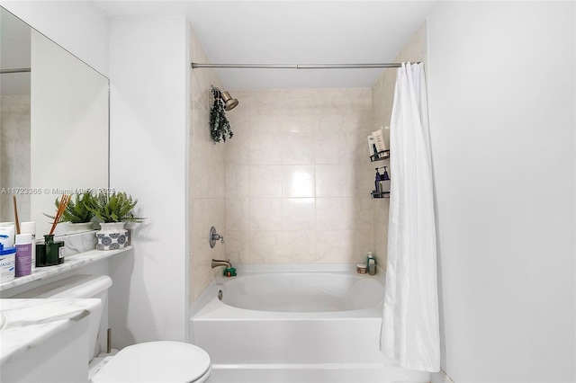 bathroom featuring shower / bath combo and toilet