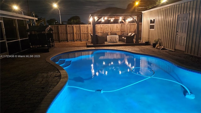 view of swimming pool with outdoor lounge area and a patio