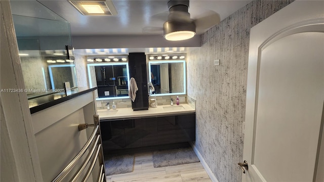 bathroom with vanity and wood-type flooring