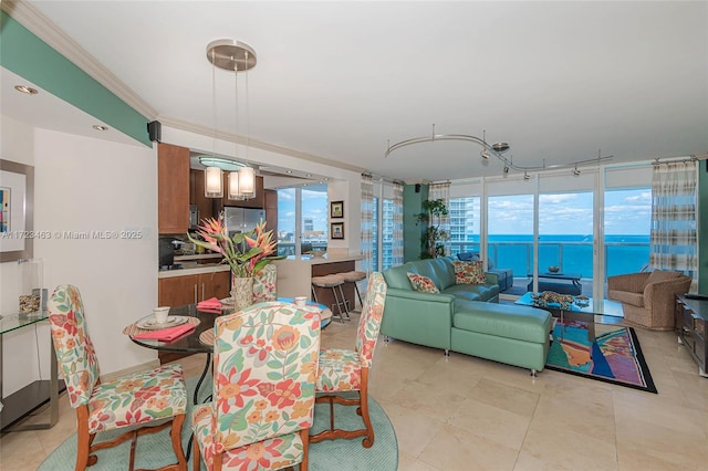 dining space featuring a water view, a wall of windows, and ornamental molding