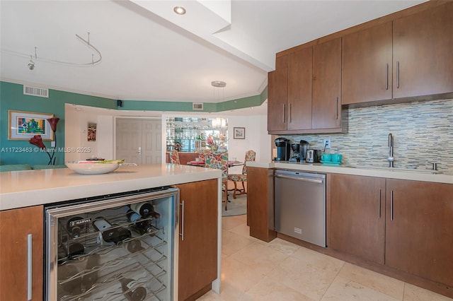 kitchen with decorative backsplash, sink, beverage cooler, and dishwasher