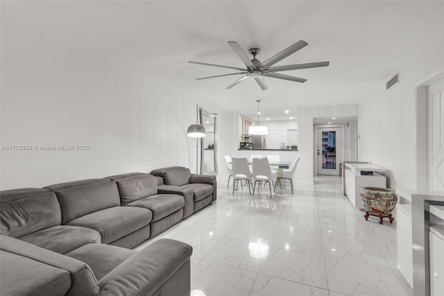 living room featuring ceiling fan