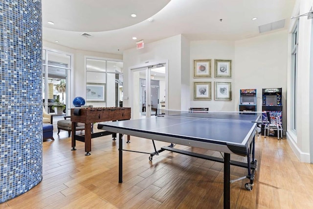 recreation room featuring light hardwood / wood-style flooring