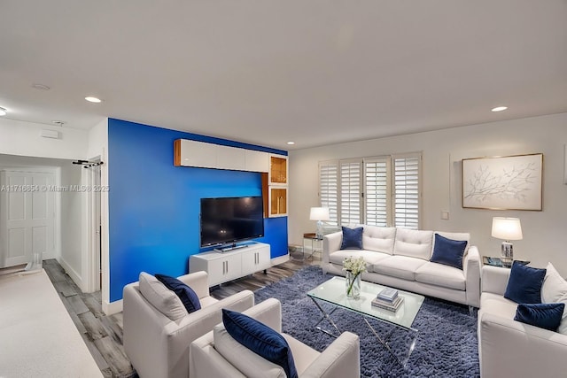 living room with light hardwood / wood-style flooring