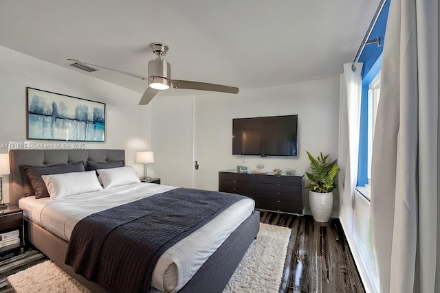 bedroom featuring ceiling fan and dark wood-type flooring