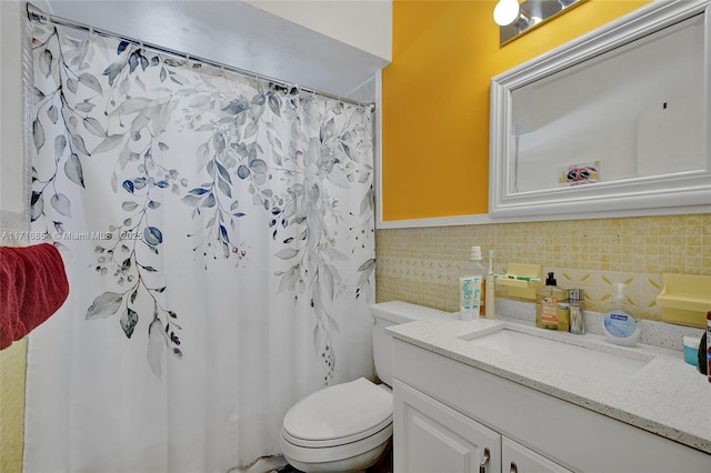 bathroom featuring walk in shower, vanity, and toilet