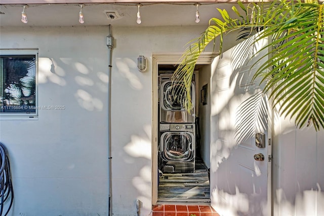 exterior details featuring stacked washer / dryer