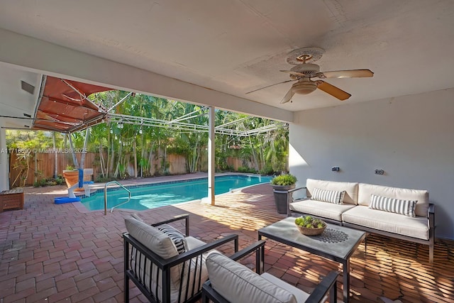 view of pool with outdoor lounge area, a lanai, and a patio