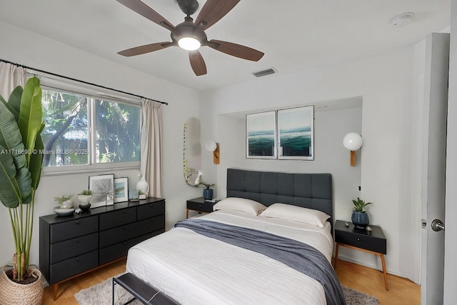 bedroom featuring light wood-type flooring and ceiling fan