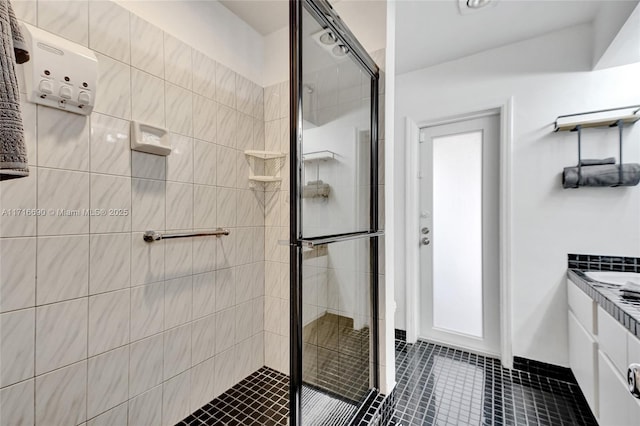 bathroom with vanity, tile patterned floors, and walk in shower