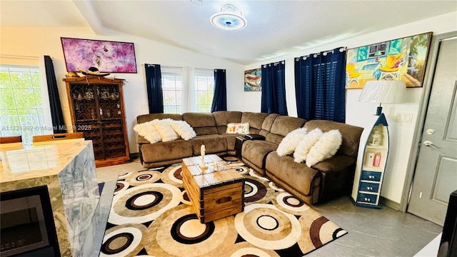 tiled living room with vaulted ceiling