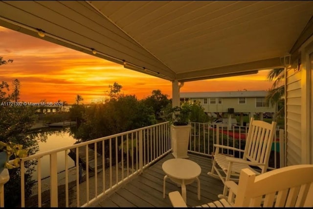 balcony at dusk with a water view