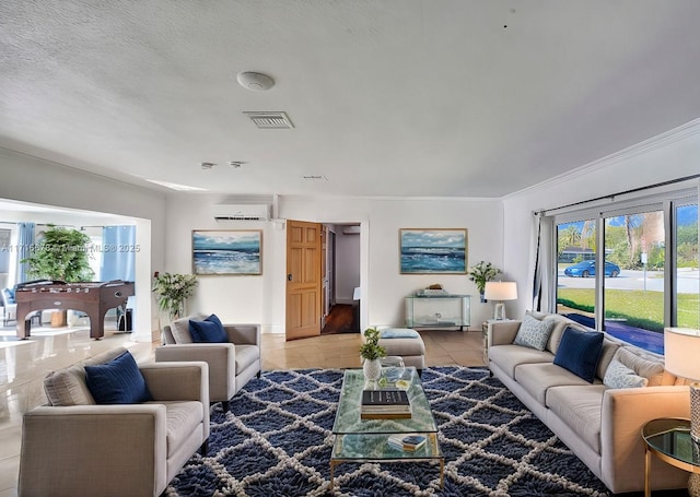 living room with light tile patterned floors and a textured ceiling