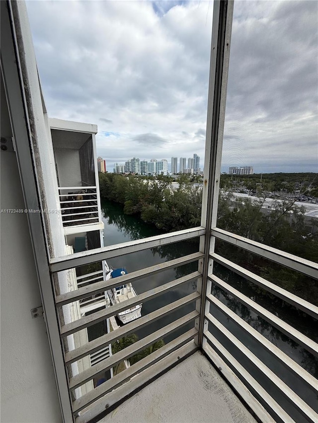 balcony featuring a water view