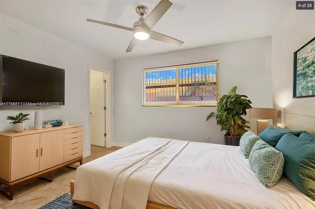 tiled bedroom featuring ceiling fan