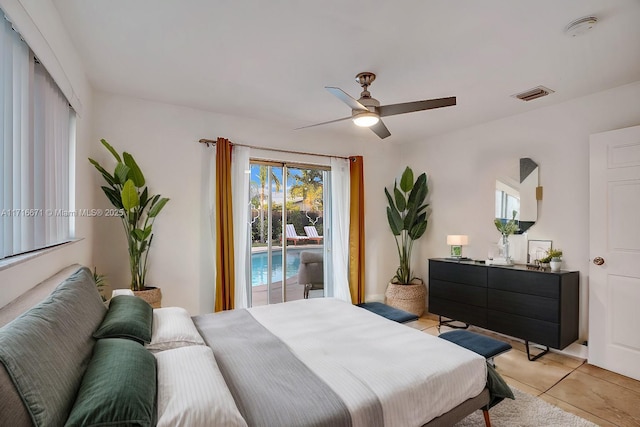 bedroom with access to exterior, visible vents, ceiling fan, and light tile patterned flooring