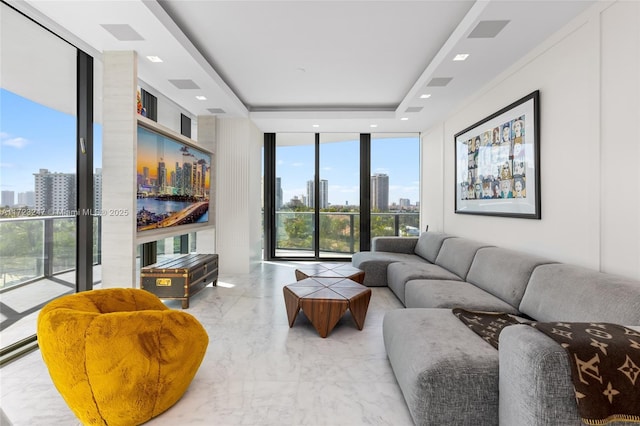 living room featuring floor to ceiling windows