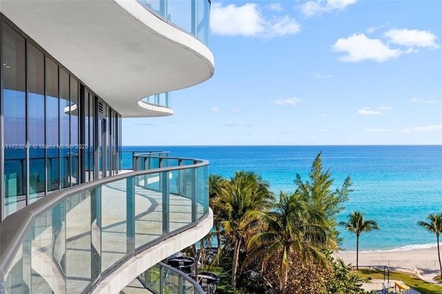 exterior space featuring a view of the beach and a water view