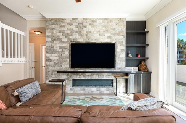 living room with ornamental molding and built in shelves