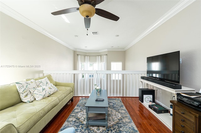 living room with crown molding and dark hardwood / wood-style flooring