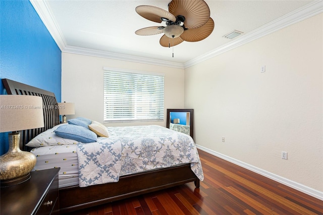 bedroom featuring dark hardwood / wood-style flooring, ornamental molding, and ceiling fan