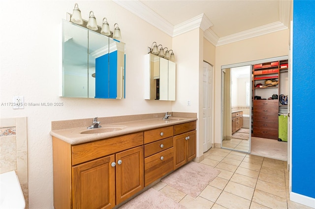 bathroom with tile patterned flooring, vanity, and crown molding