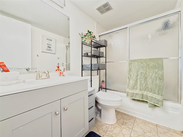 full bathroom with vanity, toilet, and enclosed tub / shower combo