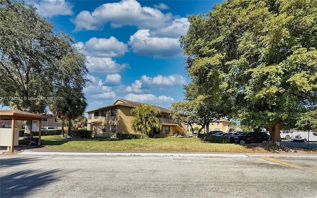 view of front of home with a front yard