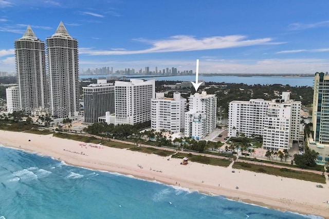 city view featuring a view of the beach and a water view