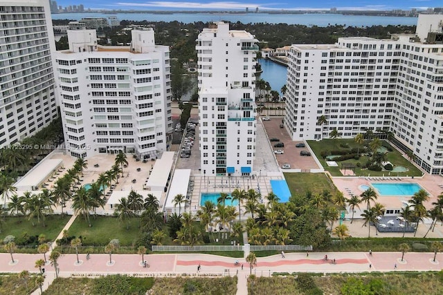 birds eye view of property featuring a water view