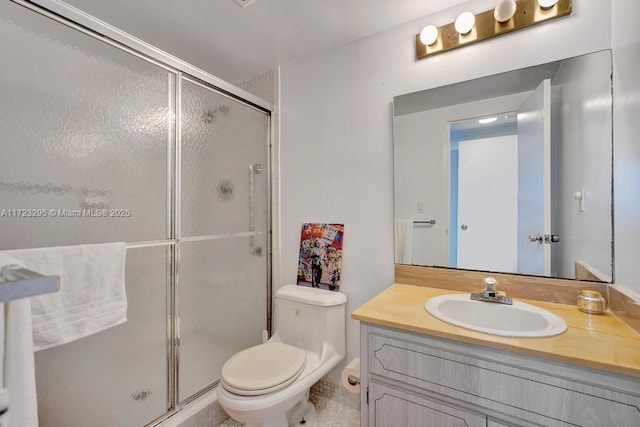 bathroom featuring vanity, toilet, and walk in shower