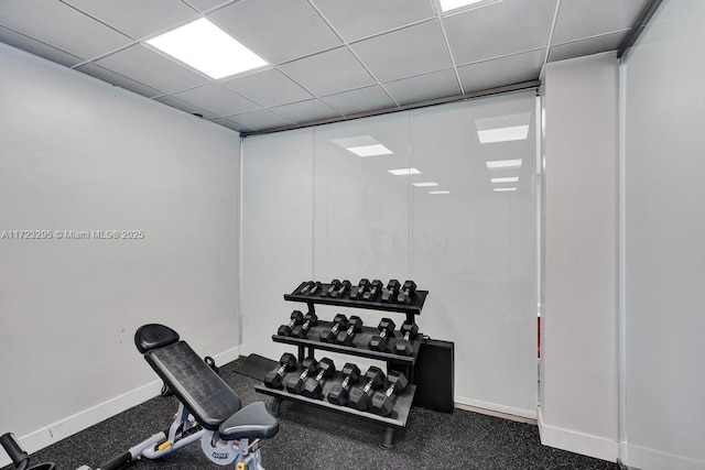 workout room with a drop ceiling