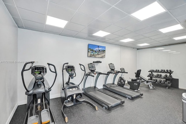 workout area with a paneled ceiling