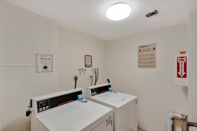 laundry room with washer and clothes dryer