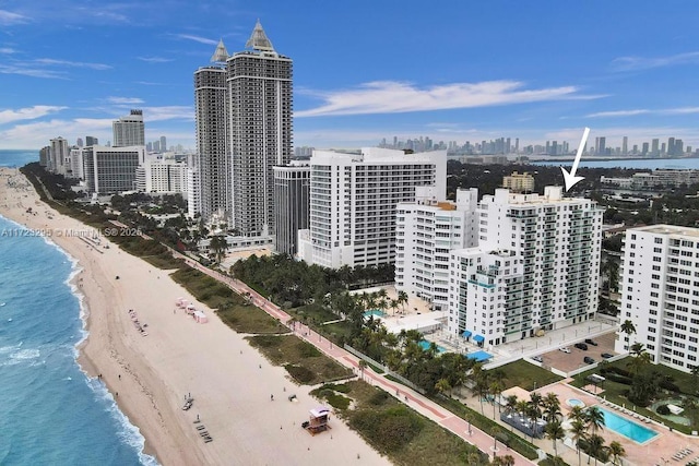 city view featuring a view of the beach and a water view