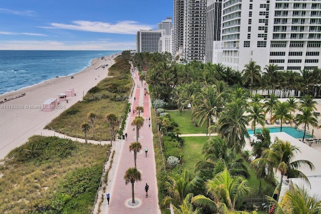 drone / aerial view featuring a view of the beach and a water view