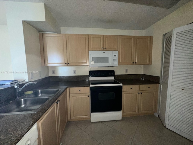 kitchen with sink, a textured ceiling, white appliances, light brown cabinetry, and light tile patterned floors