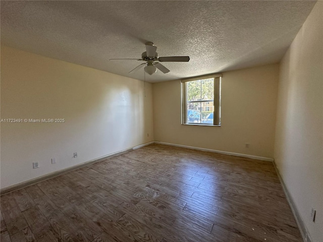 unfurnished room featuring hardwood / wood-style floors, ceiling fan, and a textured ceiling