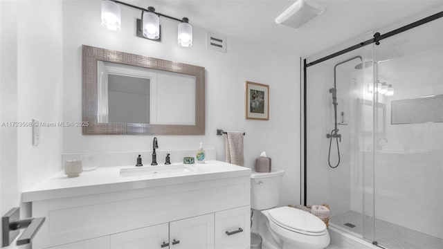 bathroom with vanity, toilet, and walk in shower