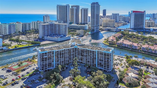 aerial view featuring a city view and a water view