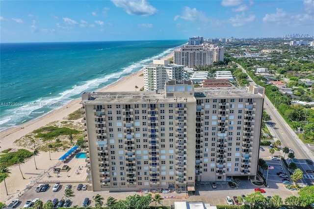 bird's eye view featuring a beach view and a water view