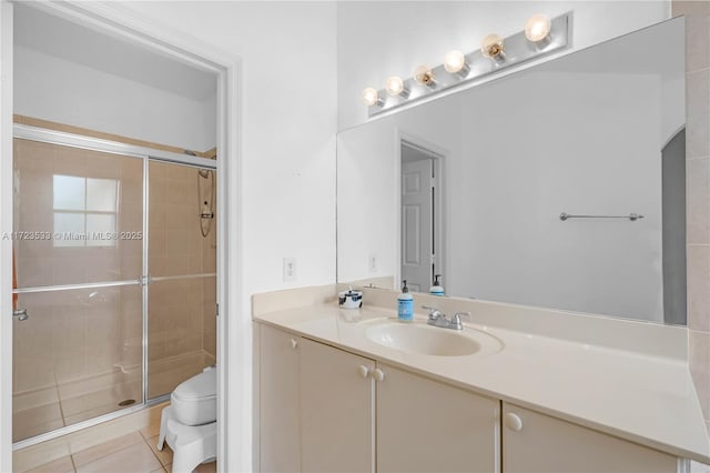 bathroom with tile patterned flooring, vanity, toilet, and a shower with door